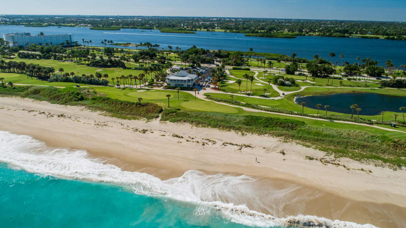 Aerial view of Palm Beach Par 3 Golf Course seen from the Atlantic Ocean and included in article by Michael Duranko of GolfToons titled 'Small but Mighty' originally published in The Golf Supplier.