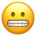 Bagaimana Grimacing Face emoji terlihat di Apple.