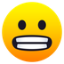 Bagaimana Grimacing Face emoji terlihat di Joypixels.