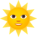 Bagaimana Sun with Face emoji terlihat di Joypixels.