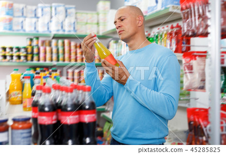 Portrait of calm man making purchases in the grocery store 45285825