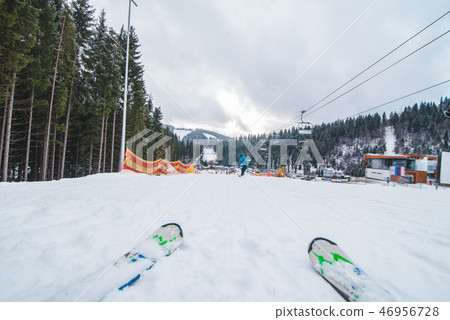 ski run close up snowed mountains on background 46956728