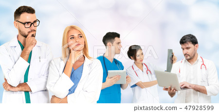 Doctor working in hospital with other doctors. 47928599