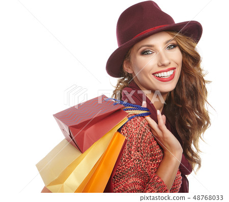 Shopping woman holding bags . smiling girl 48768033