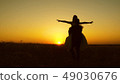 Young bride and groom circling on background of romantic red sunset. Honeymoon. The relationship 49030676