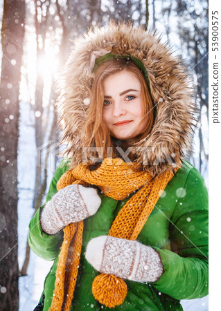 Young woman winter portrait. Portrait of happy girl. Expressing positivity, true brightful emotions 53900575