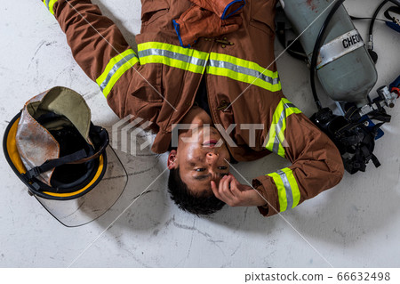 Asian male and female firefighter portrait, young smiling fireman in uniform 476 66632498