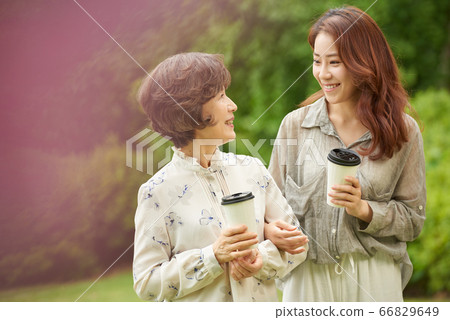 Mother and daughter walking 66829649