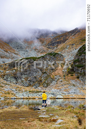 woman trekking in high mountains social distancing 71170692