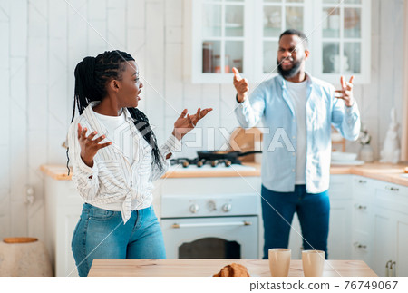 Domestic Fight. Portrait Of Annoyed Black Spouses Emotionally Arguing In Kitchen 76749067