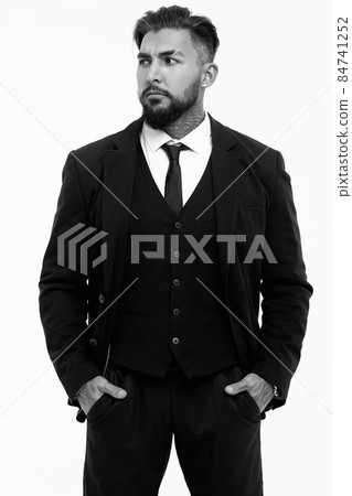 Man in elegant clothes on gray backdrop 84741252