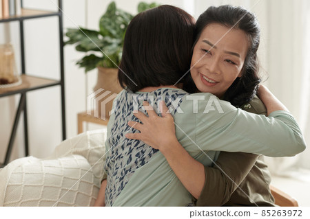 Senior Woman Hugging Best Friend 85263972