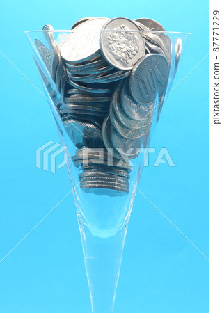 Coins in a glass 87771229