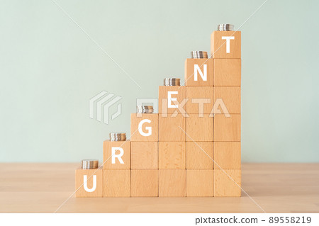 Urgent image | Building blocks and coins with "URGENT" written on them 89558219