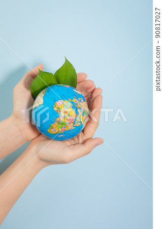 protection of the environment, hand wrapped globe and leaves photo 90817027