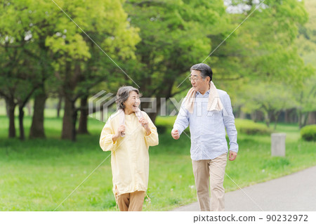 Active senior walking couple 90232972