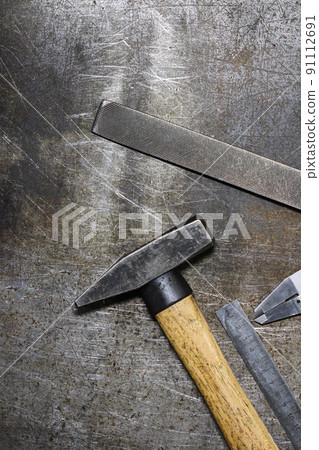 Set of various home tools lying in row on old metall background. Men's style. 91112691