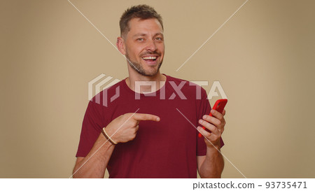 Handsome young man using smartphone show thumbs up like, positive feedback, recommends 5G connection 93735471