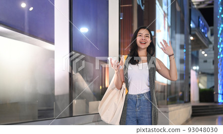 Caucasian shopper woman carrying bags with shopping. 93048030