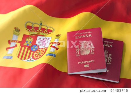 Passport of Spain on spanish flag. Citizenship, immigration, travel and tourism concept. 94405746