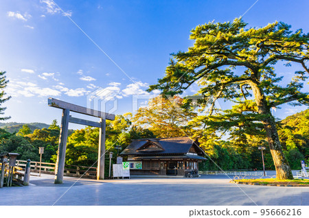 Ise Jingu Inner Shrine Uji Bridge Torii illuminated by the morning sun 95666216