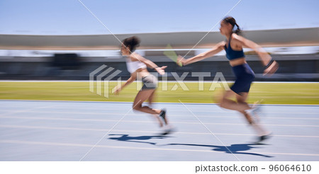 Relay race, running and sports women at a stadium for training, energy and workout. Sport, runner and baton pass on a running track by athletic team for fitness, marathon and speed performance 96064610