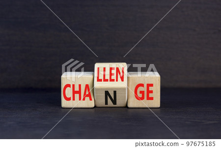 Challenge and change symbol. Concept word Challenge Change on wooden cubes. Beautiful black table black background. Business and challenge and change concept. Copy space. 97675185