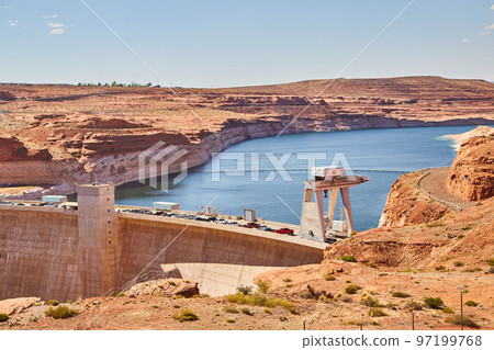 Dam blocking river water in red desert landscape 97199768