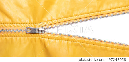 Yellow leather texture and open metal zipper isolated on white background 97248958