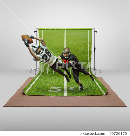 Competition. Two men, professional american football players in uniform playing over sports playground background. Concept of sport 99726170