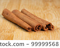 Cinnamon sticks on a wooden background. Fragrant cinnamon seasoning close-up. Spices with cinnamon. Food cooking video concept. ingredients for warm wine, mulled wine 99999568