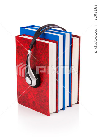 Concept of audio books with earphones on white 8205165