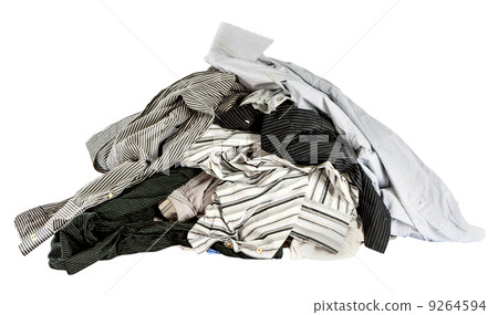 stacked used shirts isolate on white bcakground 9264594