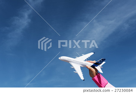 Little Girl Playing Toy Plane Concept 27230084