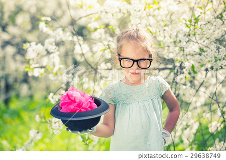 Funny girl in glasses with hat and gloves. 29638749