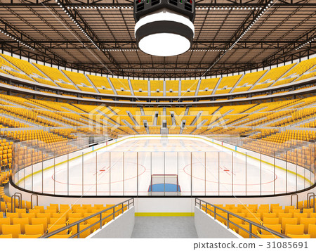 Large modern ice hockey arena with yellow seats 31085691