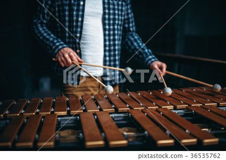 Xylophone player hands with sticks, wooden sounds 36535762