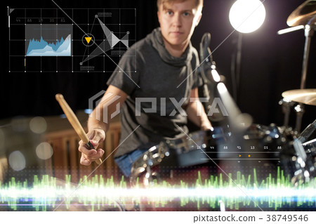 male musician playing drum kit at concert 38749546