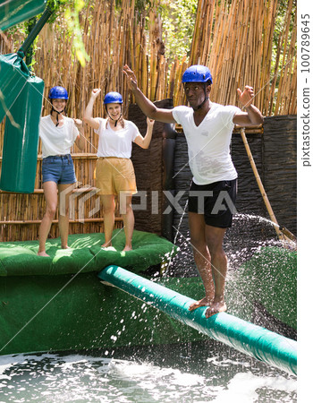 People passing crossbar with obstacles 100789645