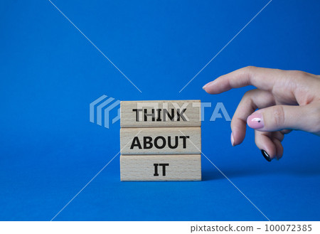 Think about it symbol. Wooden blocks with words Think about it. Beautiful blue background. Businessman hand. Business and Think about it concept. Copy space. 100072385