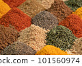 Assortment spices and herbs for cooking. Spice and seasoning. Various fragrant spice market. Heap different Asian Spices lies on wooden background 101560974