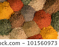 Spice and seasoning. Various fragrant spice market. Heap different Asian Spices lies on wooden background. Assortment spices and herbs for cooking 101560973