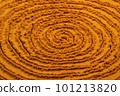 Spiral poured turmeric powder spice background. Dry seasoning turmeric. Spices and herbs for cooking, curcuma 101213820