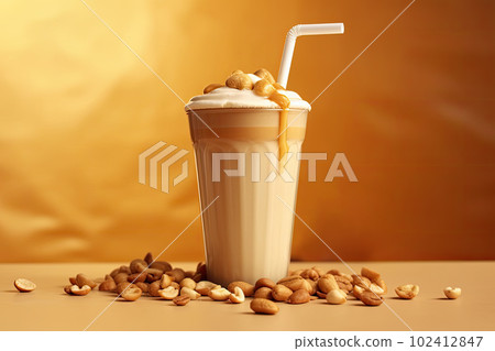 Frappe drink with caramel an nuts on golden background. AI generative. 102412847