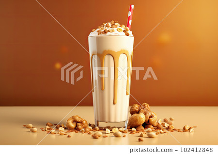 Frappe drink with caramel an nuts on golden background. AI generative. 102412848