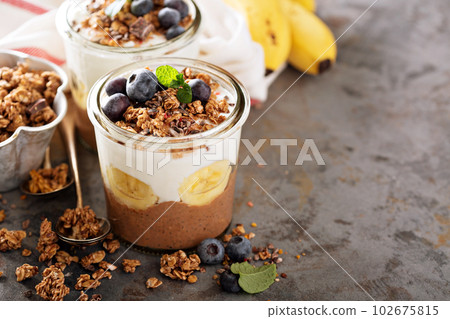 Chocolate chia pudding with banana slices 102675815