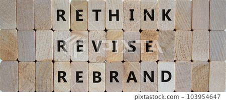 Rethink, revise, rebrand symbol. Wooden blocks with words 'rethink, revise, rebrand'. Beautiful wooden background. Business, rethink, revise, rebrand concept. Copy space. 103954647