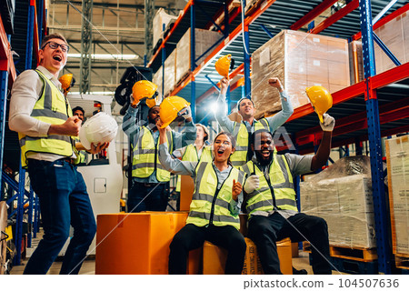 Professional warehouse worker team celebrating success in warehouse factory 104507636