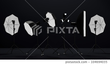 Photography studio flash on a lighting stand on black background 104694035