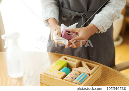 Hand photo of a woman who disinfects toys 105546788